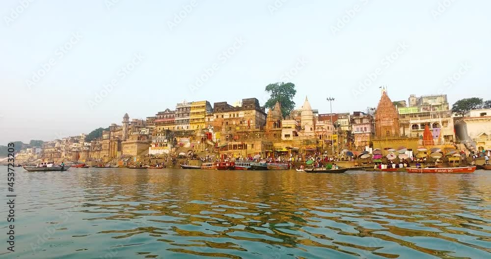 River Ganges in Varanasi with Buildings Lit in the Morning Sunrise in India. River Ganges in Varanasi with Buildings Lit in the Morning Sunrise in India.