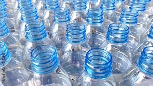 blue clear plastic unfilled drinking water bottle.