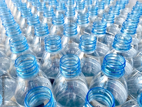 blue clear plastic unfilled drinking water bottle.