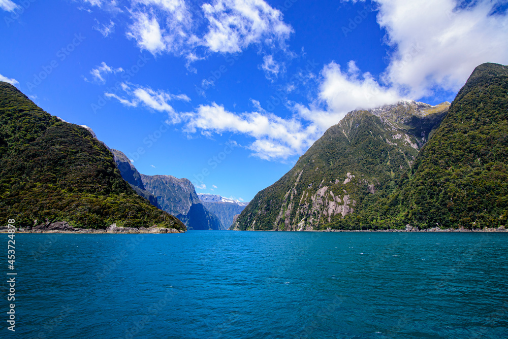 Beautiful scenic Milford Sound with blue sky, Fiordland, New Zealand