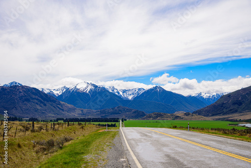 Road to Mount Cook Peak mountain New Zealand with blue sky.