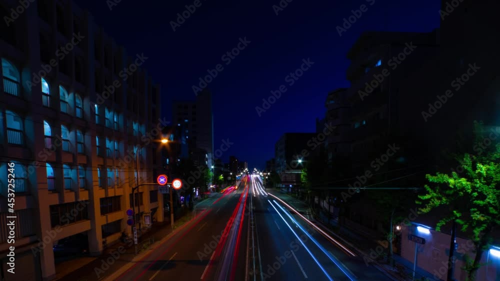 A night timelapse of the downtown street in Tokyo wide shot panning A night timelapse of the downtown street in Tokyo wide shot panning