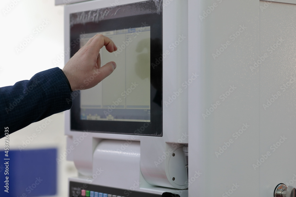 engineer controls modern equipment by touchscreen engineer controls modern equipment by touchscreen