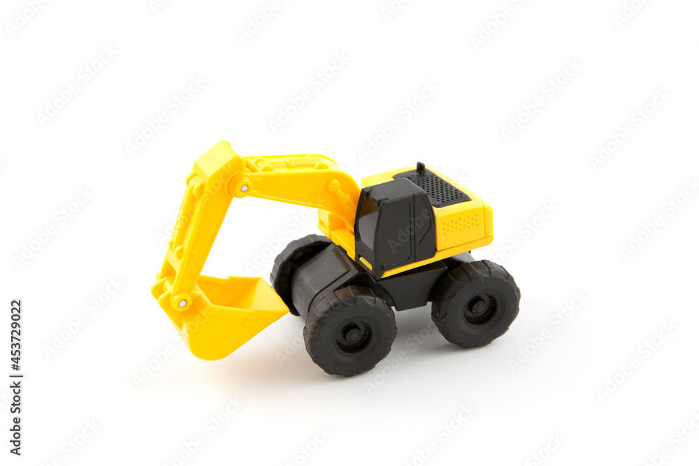 Excavator plastic toy isolated on white background 