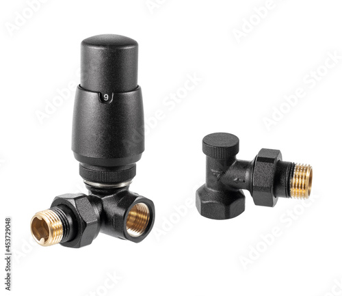 Black thermostatic radiator valves (TRV). Self-regulating valve for hot water heating system radiator. © Serhii