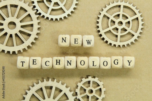 rida gears and wooden cubes with the words New Technology photo