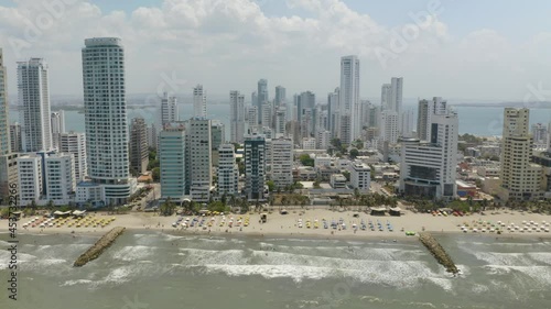 Waves Crashing on Cartagena Beaches in Summer. Fixed High Aerial Shot photo