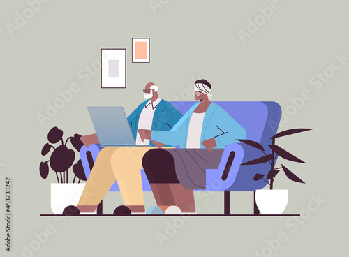 senior couple using laptop grandparents relaxing at home social media network online communication concept