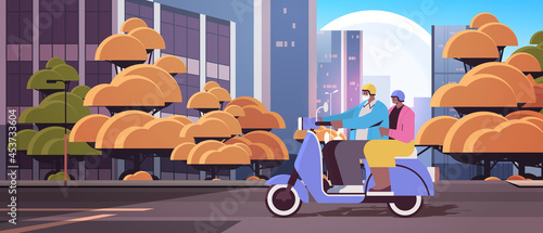 senior african american couple in helmets driving scooter grandparents traveling on moped active old age concept