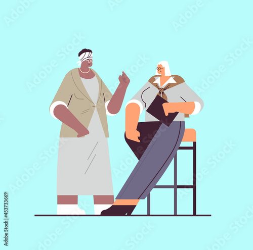 senior businesspeople discussing during meeting mix race business people in formal wear working together old age