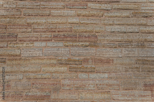 Wall surface with sanded masonry.