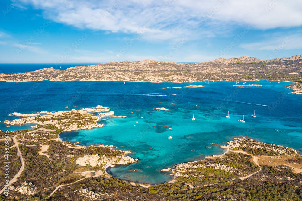 View from above, stunning aerial view of La Maddalena Archipelago with its turquoise, crystal clear bays of water. Caprera Island in the distance. Sardinia, Italy.