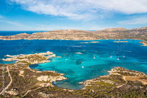 View from above, stunning aerial view of La Maddalena Archipelago with its turquoise, crystal clear bays of water. Caprera Island in the distance. Sardinia, Italy.