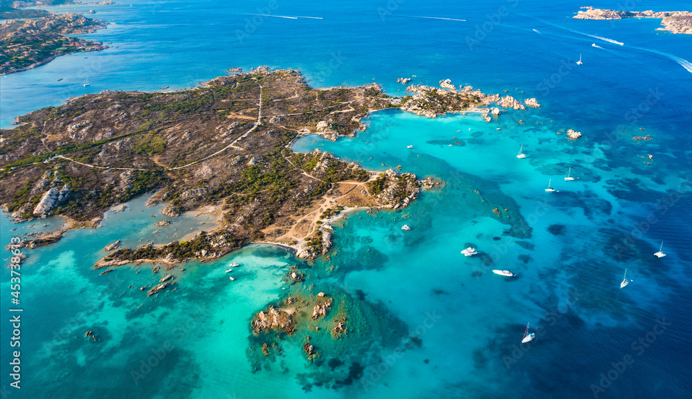 View from above, stunning aerial view of La Maddalena Archipelago with Giardinelli Island bathed by a turquoise, crystal clear water. Sardinia, Italy.