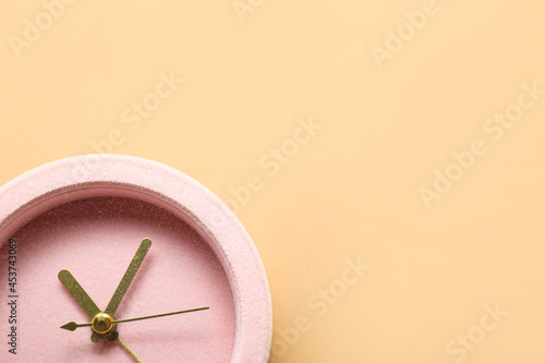 Alarm clock on color backgr...