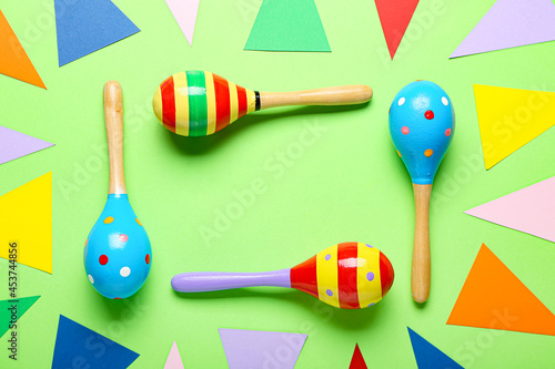 Frame made of Mexican maracas on color background © Pixel-Shot