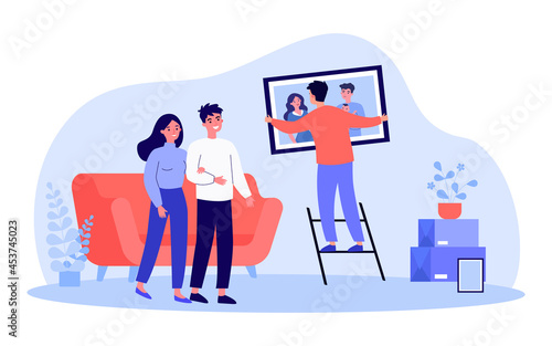 Young man hanging family portrait on wall. Flat vector illustration. Couple watching man helping by hanging framed photograph on wall in living room. Family, photography, service, decoration concept