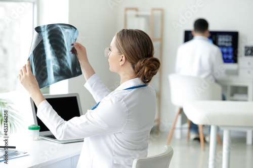 Female doctor with x-ray im...