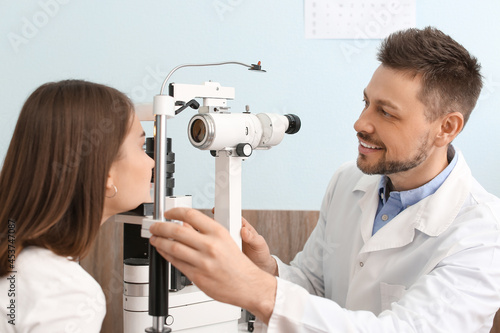 Ophthalmologist examining y...