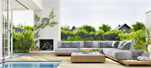 Outdoor patio area with garden furniture, swimming pool and outdoor fireplace photo