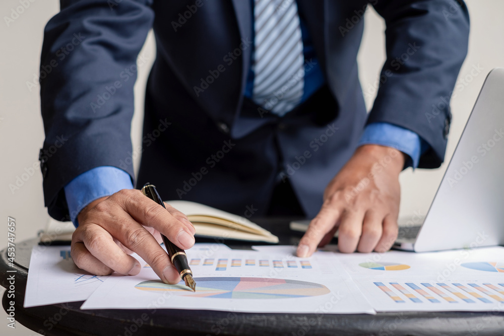 work from home, The hand of the businessman who works in finance at home and calculates financial graphs showing the results of his investments, planning the steps of his business growth work from home, The hand of the businessman who works in finance at home and calculates financial graphs showing the results of his investments, planning the steps of his business growth