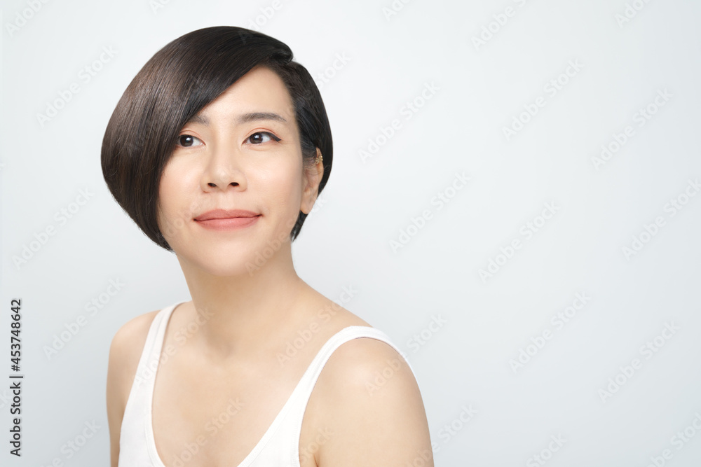 Glowing skin treatment. Portrait of a beautiful asian woman with flawless facial wearing natural makeup look in white inner wear. K-beauty, Collagen, Skincare, Hair Products, Clinic, V shape, 40s, 30s Glowing skin treatment. Portrait of a beautiful asian woman with flawless facial wearing natural makeup look in white inner wear. K-beauty, Collagen, Skincare, Hair Products, Clinic, V shape, 40s, 30s
