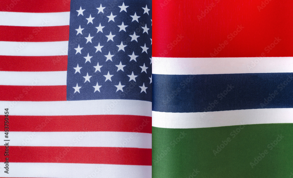 Fototapeta premium fragments of the national flags of the United States and Republic of the Gambia in close-up