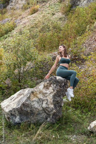perfect xummer vacation woman posign near rocks
