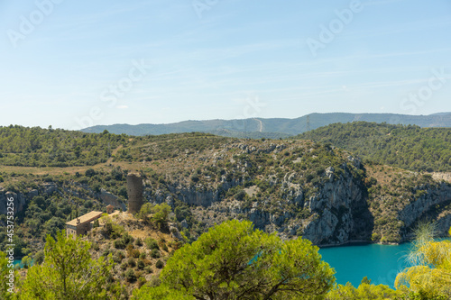 landscape of the water reservoir in Torreciudad Spain with a collapsed church and surrounded by mountains