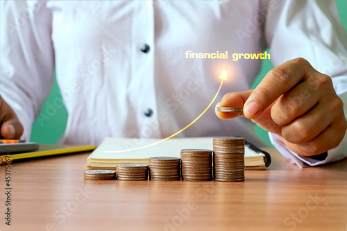 Hand holding coins and rising monetary coins, financial growth concept. investment and financial planning