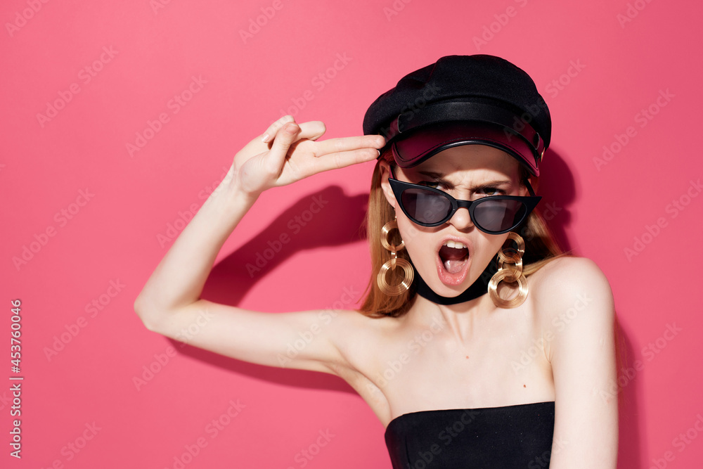 pretty woman in a black dress makeup pink background pretty woman in a black dress makeup pink background