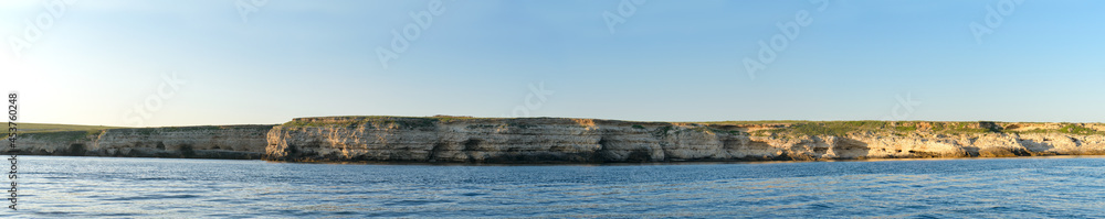 Rocky sea coast on Cape Tarkhankut in the Crimea on a summer evening