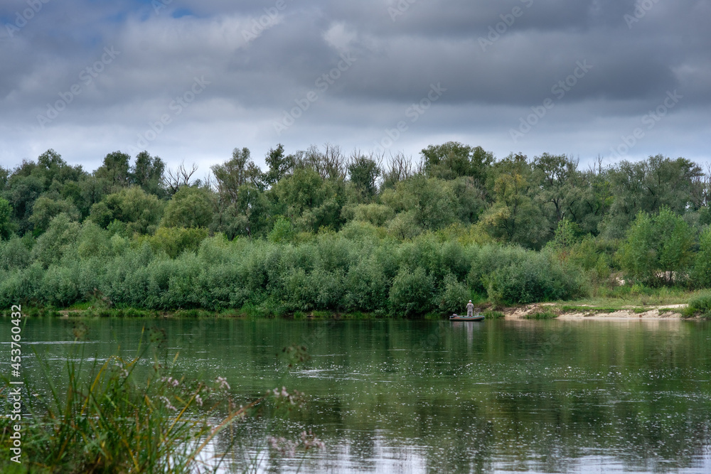 Beautiful view of Ukrainian Desna river, calm waters, dramatic skies Beautiful view of Ukrainian Desna river, calm waters, dramatic skies