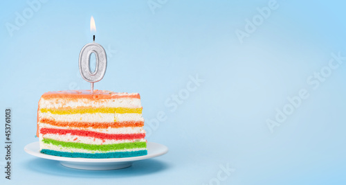 Birthday cake with burning zero candle