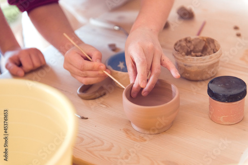 pottery workshop for kids, girl working with clay