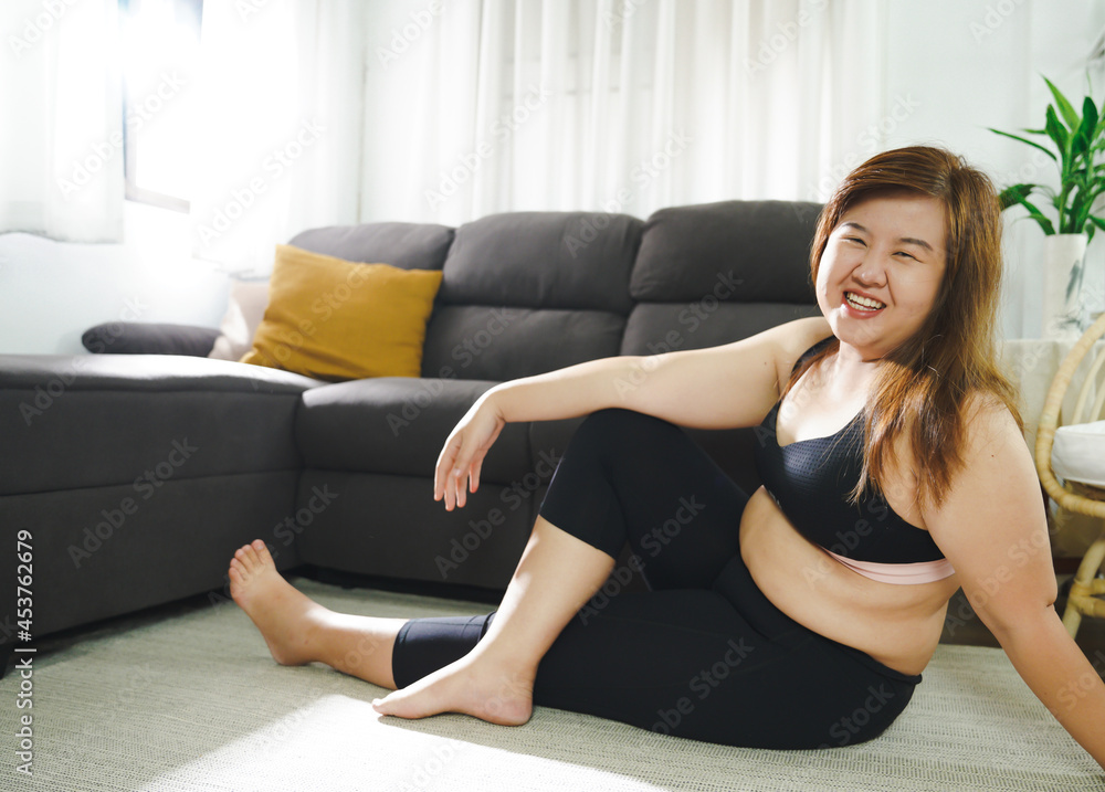 Body confidence. Asian woman Overweight plus size woman wearing sportswear for exercising. self confident Body positive concept. Body confidence. Asian woman Overweight plus size woman wearing sportswear for exercising. self confident Body positive concept.