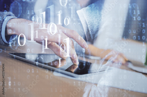 Double exposure of data theme hologram drawing and man and woman working together holding and using a mobile device.