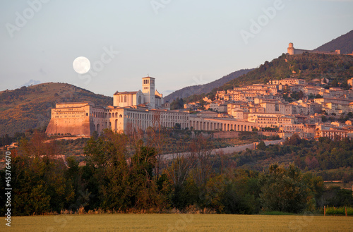 Basilica of Saint Francis in Assisi with the full moon, Italy