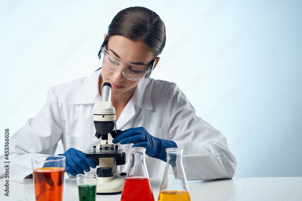 laboratory assistant in a white coat work table microscope diagnostics biotechnology laboratory assistant in a white coat work table microscope diagnostics biotechnology