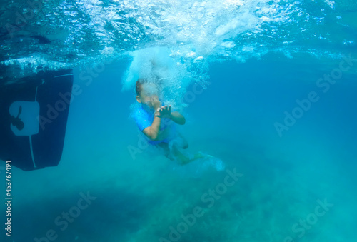 Baby girl swimming underwater