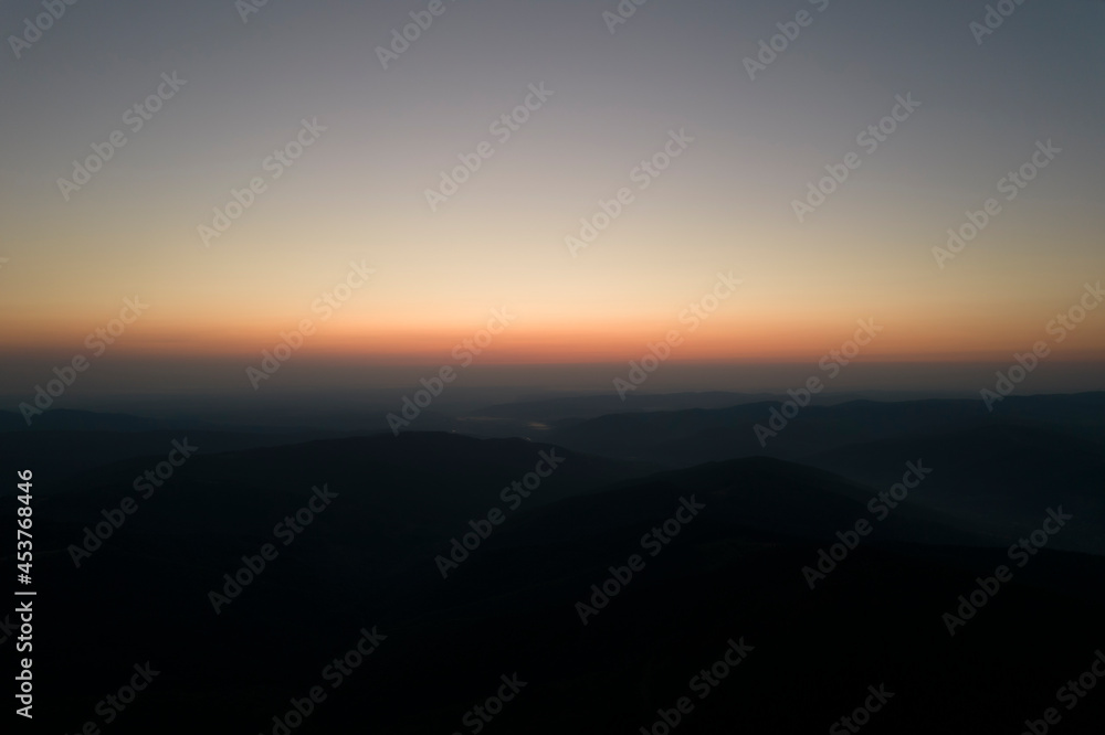 Vivid sunset in mountains. Colorful background.