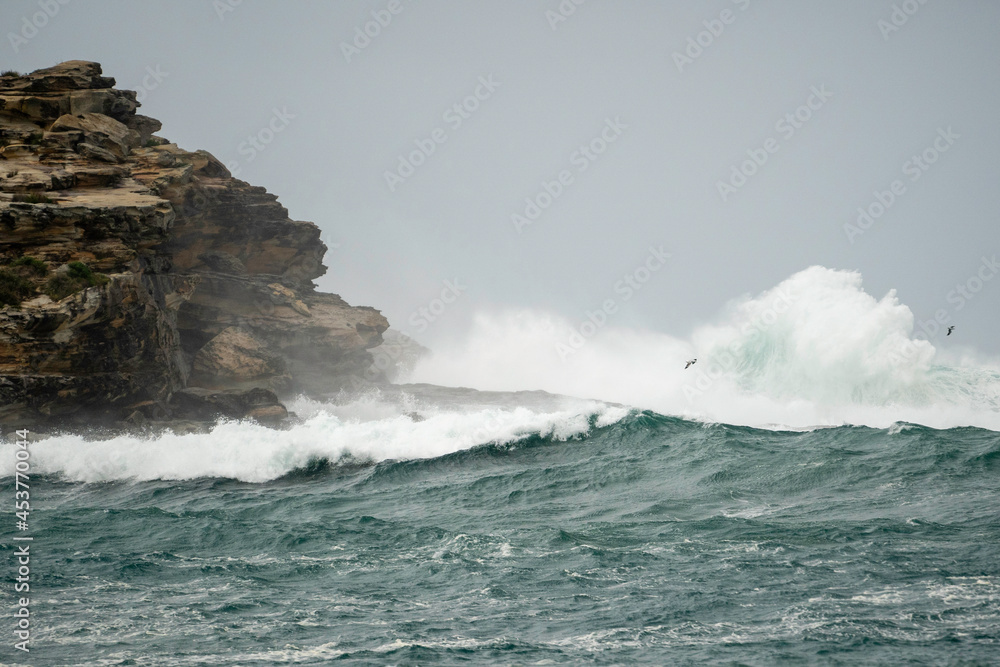 waves crashing on rocks during a storm