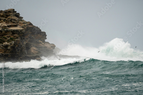 waves crashing on rocks during a storm