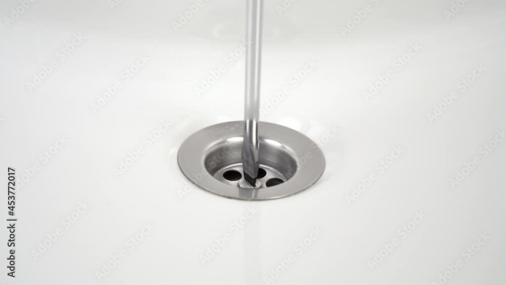 Service repair of the plumbing system of the bathroom sink using a