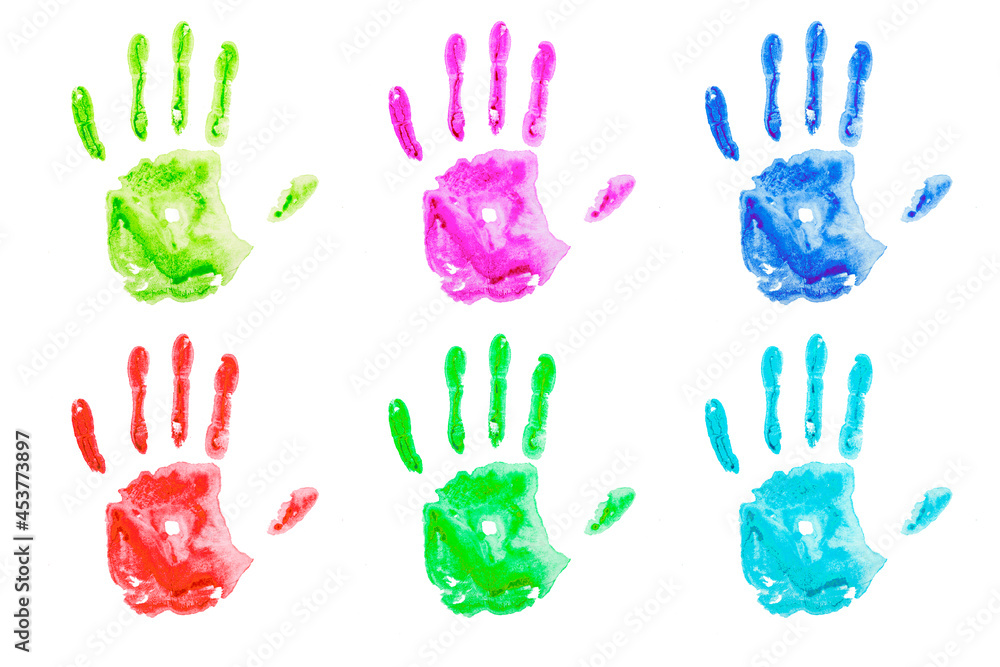 Fototapeta premium Colored handprints on white paper. Multicolored palm shapes isolate