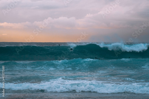 Silhoette of surfer at sunrise