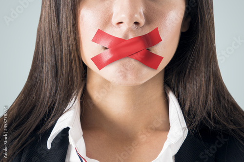 Fotografi Close up of taped caucasian businesswoman mouth