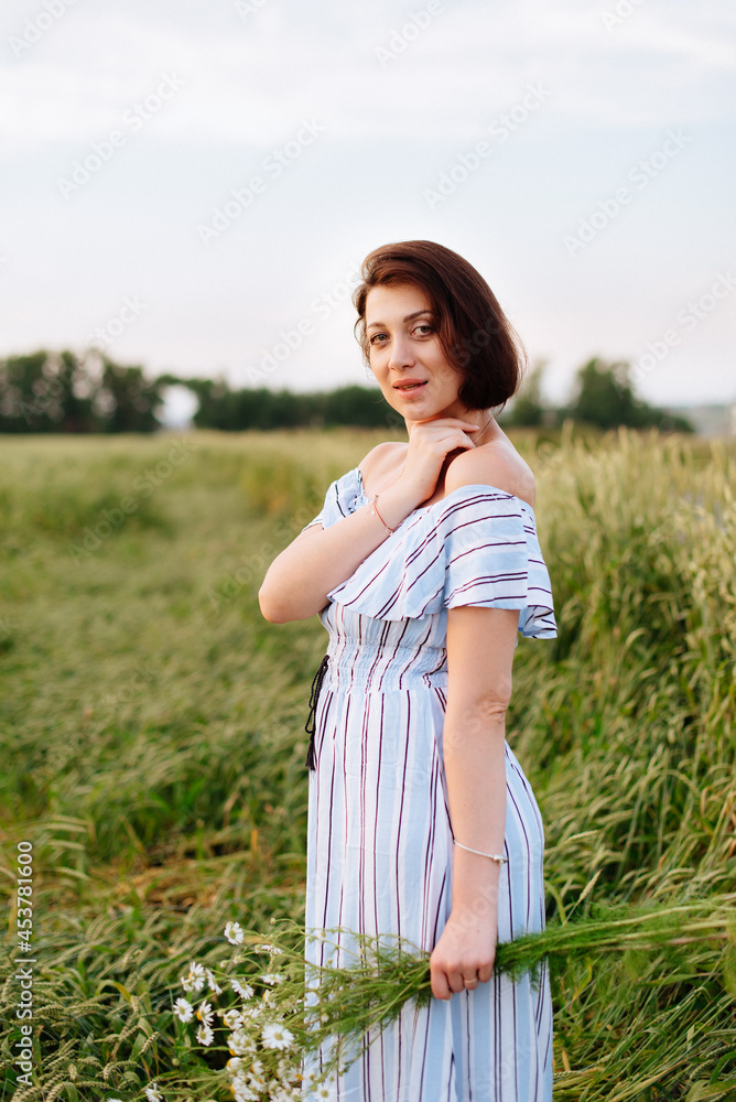 Beautiful young woman in summer in a wheat field Beautiful young woman in summer in a wheat field