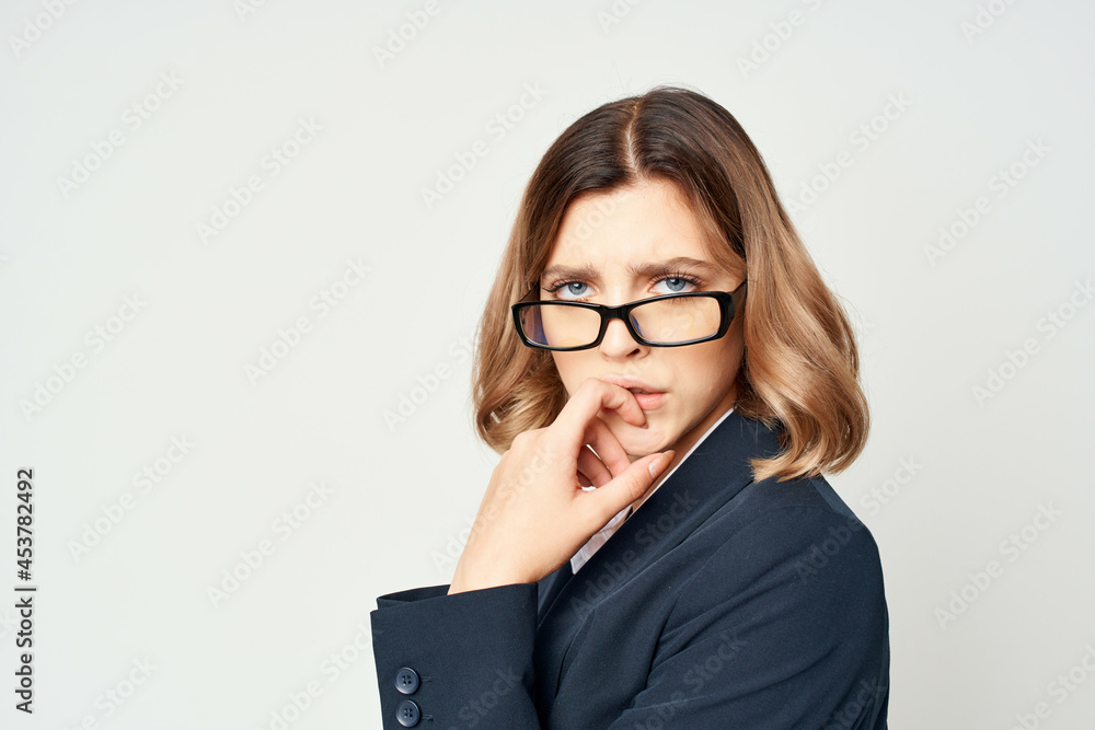 Business woman in black suit wearing glasses self confidence office