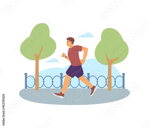 Male athlete in sportswear running marathon or training in park outdoors.